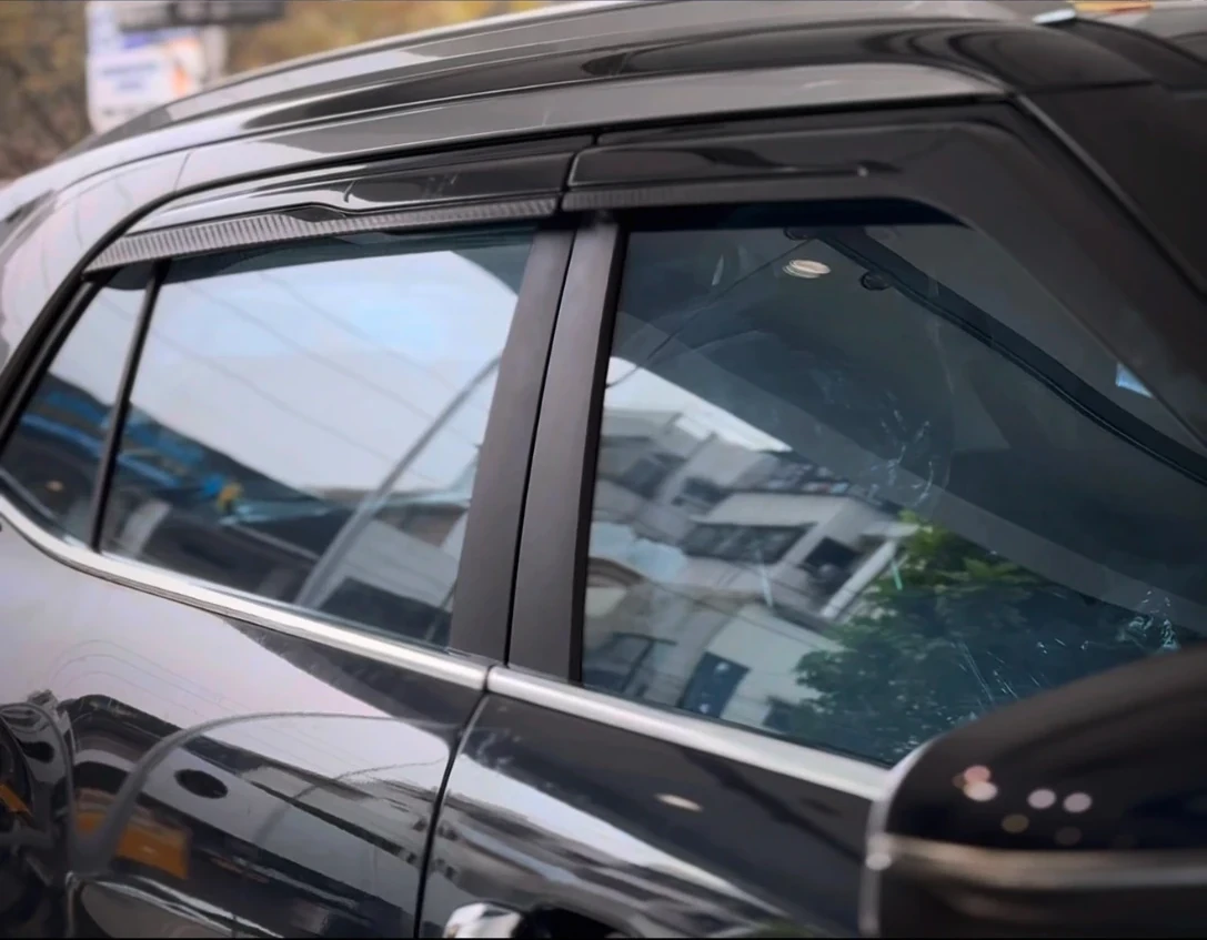 Side windows of a black SUV after SunProtek window film fitting