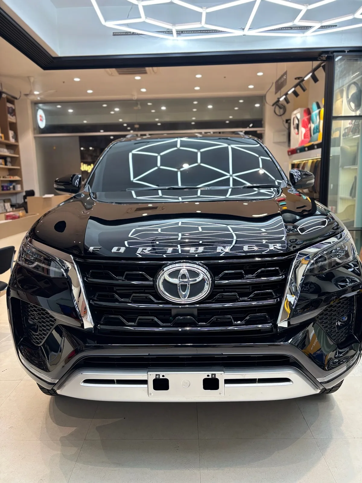 Black Toyota Fortuner with SunProtek paint protection film, front view